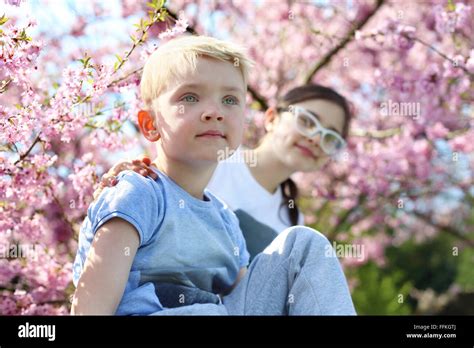 Siblings Happy Child Boy Sitting Under A Tree The Girl In The
