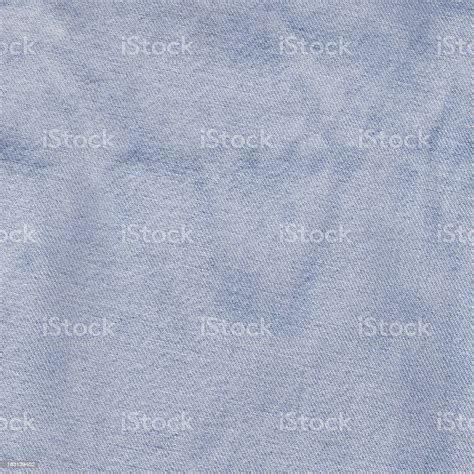 High Resolution Light Blue Denim Fabric Wrinkled Grunge Texture Stock