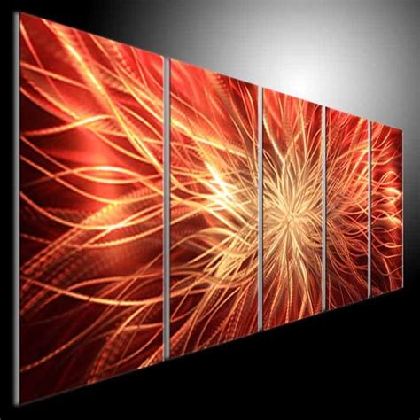A Large Metal Wall Art Piece With Red And Yellow Fireworks In The Sky