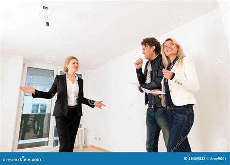 Young Couple Looking For Real Estate With Female Realtor Stock Image Image Of Broker Buying