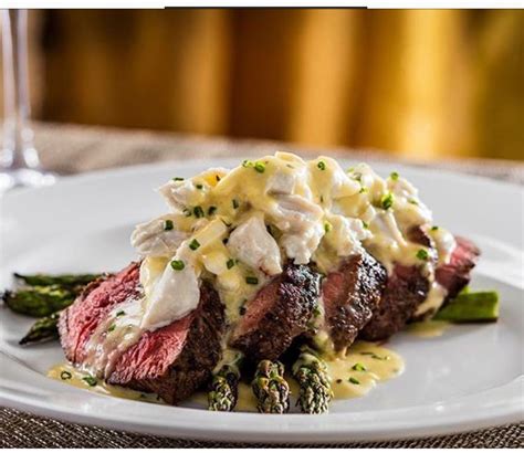 Place an oven safe sauce pot on a hot grill and pour in the wine, vinegar, shallots and tarragon. Beef Tenderloin with Lump Crabmeat, Asparagus and a Rich Hollandaise Sauce!