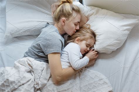 Mother And Daughter Sleep In Bed Containing Fondness Lifestyle And