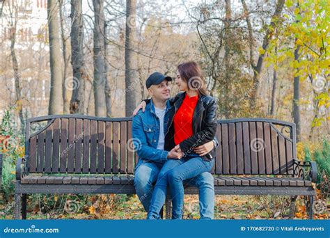 Happy Lovers In The Park On A Bench In Autumn Stock Photo Image Of
