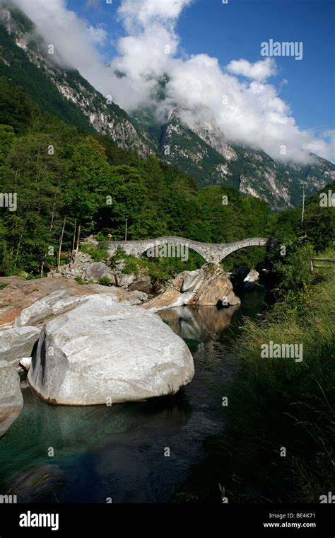 Stone Arch Bridge Ponte Dei Salti And The Quietly Flowing Verzasca