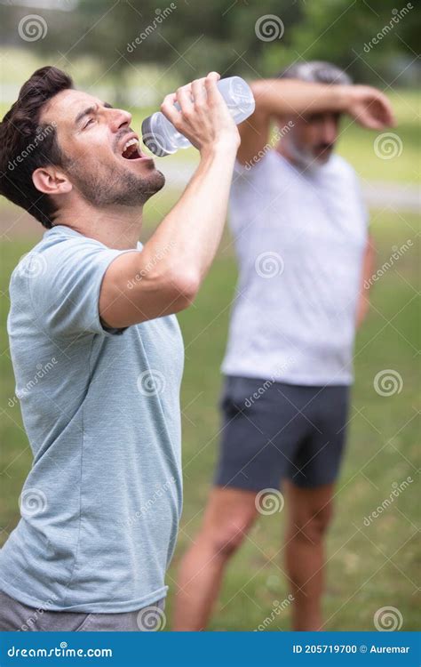 Sporty Man Drinking Water In Park Stock Photo Image Of Instructor