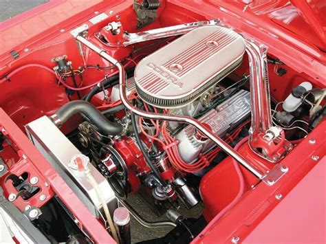 The Engine Compartment Of An Old Red Car