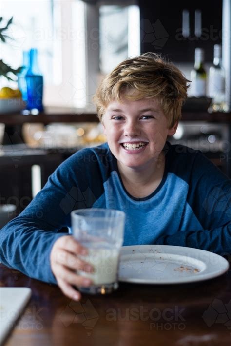 Image Of Tween Boy Enjoying Toast And Milk For Breakfast Austockphoto