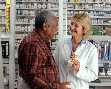 Pharmacist Free Stock Photo A Man Consulting His Pharmacist 17338