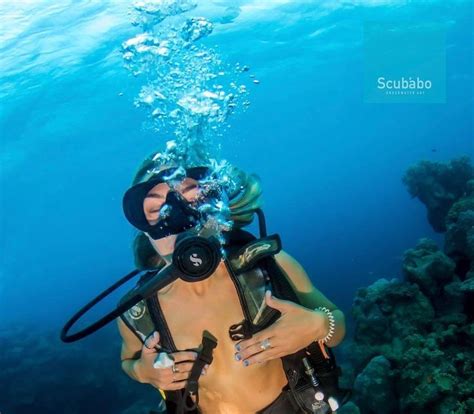 100th dive scuba girl underwater diving