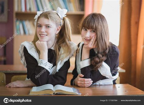 Russian Schoolgirls At The Desk At The Lesson Stock Photo By ©lex1977