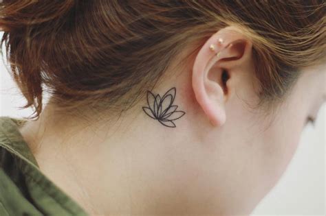Minimalist Lotus Flower Tattoo Behind The Right Ear