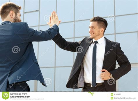 Two Business Colleagues High Fiving Stock Image Image Of Discussing
