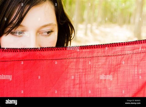 Young Curious Woman Spying Behind Veil Stock Photo Alamy