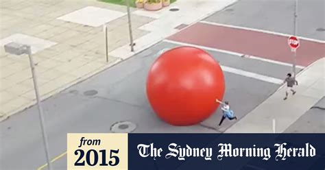 Video Giant Red Ball Goes Rogue Rolls Through City