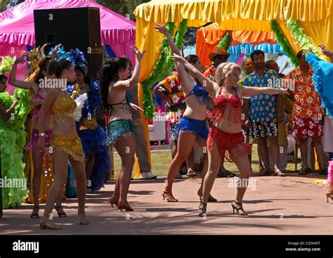 flashing showgirls in elaborate bikini performing cabaret dance at wedding reception celebration