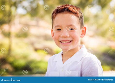 Outdoor Portrait Of A Mixed Race Chinese And Caucasian Boy Stock Photo