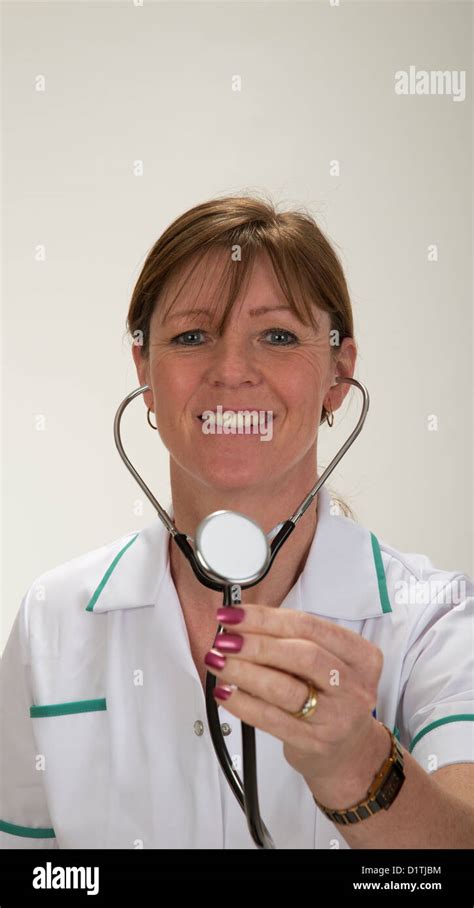Nurse Holding Stethoscope And A Happy Smiling Face Stock Photo Alamy