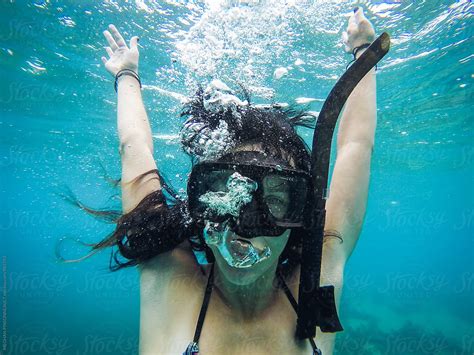 Woman Underwater In Snorkel Mask With Bubbles Stocksy United