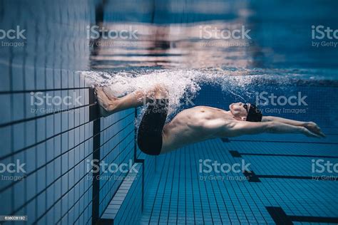 Pro Male Swimmer In Action Inside Swimming Pool Stock Photo Download