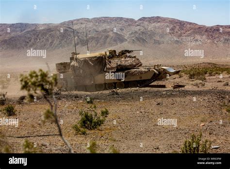 Us Marine Corps M1 Assault Breacher Vehicle Moves Toward A Barrier At