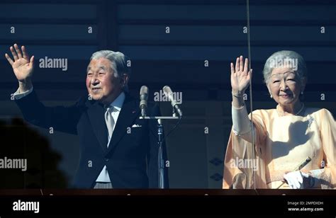 Japan S Emperor Akihito Waves To Well Wishers With Empress Michiko On The Bullet Proofed Balcony