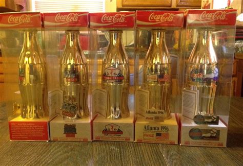 Pin On Coca Cola Gold And Silver Collector Bottles