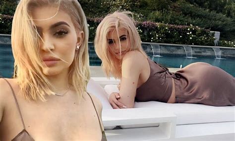 Kylie Jenner Flashes Her Toned Tummy In A Skimpy Satin Crop Top In Instagram Selfie Daily Mail