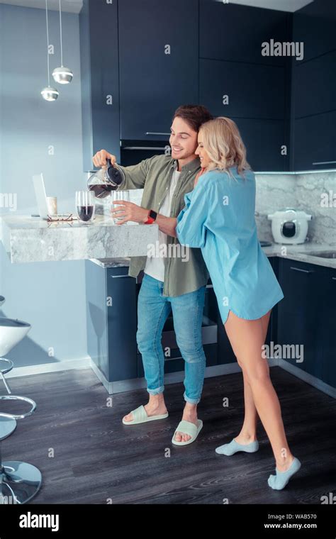 Long Legged Girlfriend Hugging Her Boyfriend Making Coffee Stock Photo