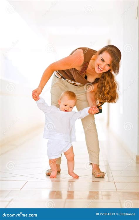 Happy Mom Helping Baby To Walk Stock Image Image 22084373