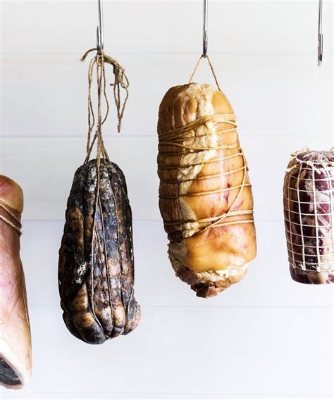 Download Premium Image Of Cured Meat Hanging In A Deli Shop 485465
