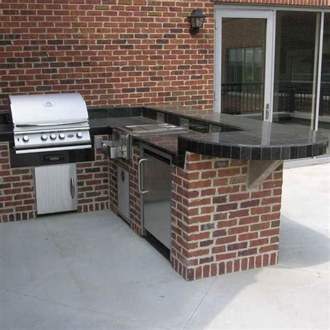 With A Grill Refrigerator And Burners This L Shaped Outdoor Kitchen