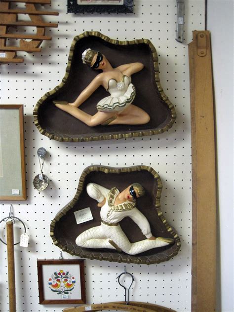 scary harlequin wall hangings at antique store in farmer c… flickr
