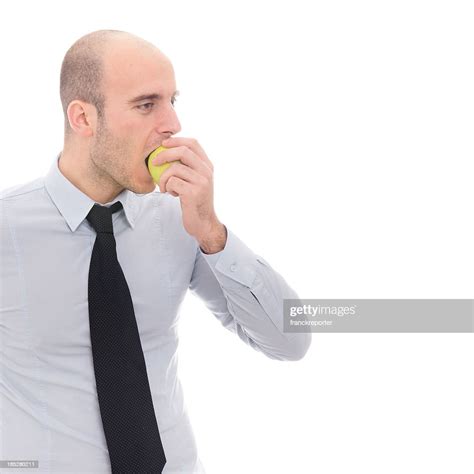 Healty Lifestyle For A Businessman Eating Apple High Res Stock Photo