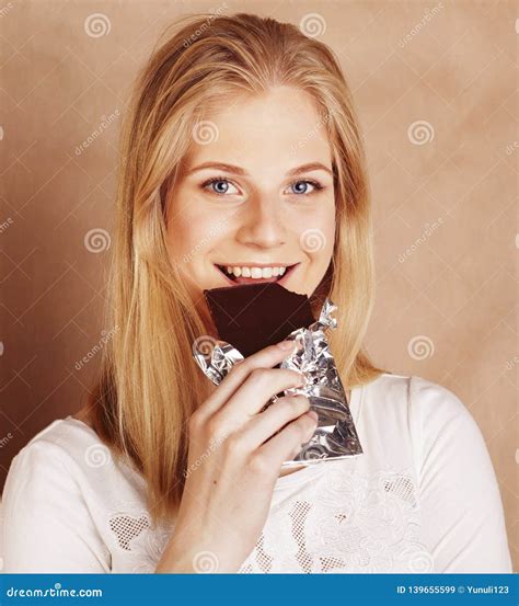 Young Beauty Blond Teenage Girl Eating Chocolate Smiling Stock Image Image Of Beauty Cool