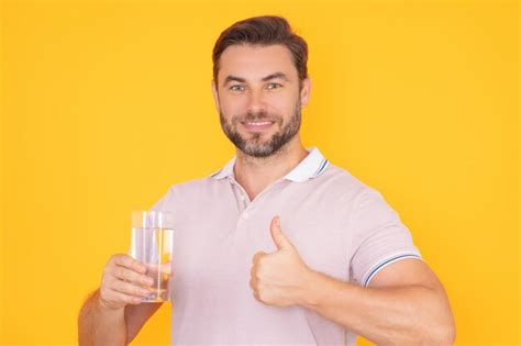 Premium Photo Man Drinking Water Portrait Of Happy Smiling Man With Glass Of Fresh Water