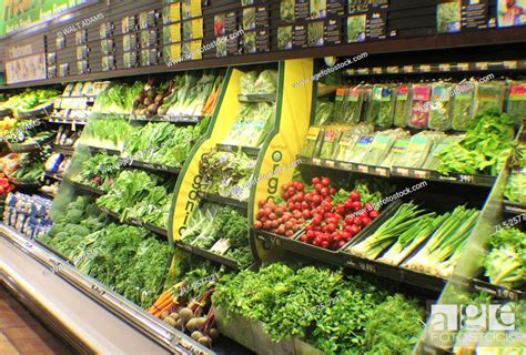 A Supermarket Produce Section Displaying A Variety Of Fresh Fruits And