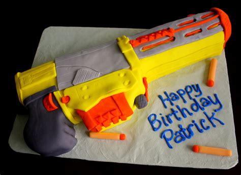 So i did this one with smarties. Claudine: Nerf Gun Cake