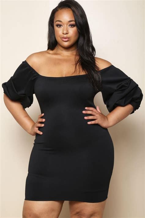 A Plus Size Mini Dress With A Scooped Neckline And Short Balloon