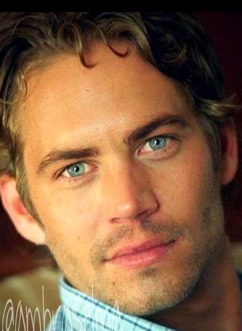 A Close Up Of A Person With Blue Eyes