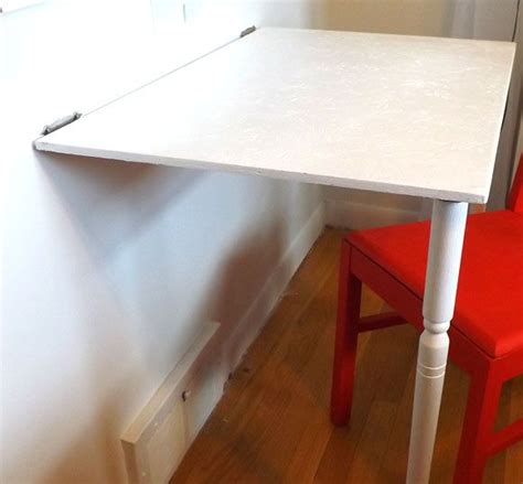 This simple fold down desk makes a great spot to get some work done. Great DIY organizing project. They also sell these fold ...