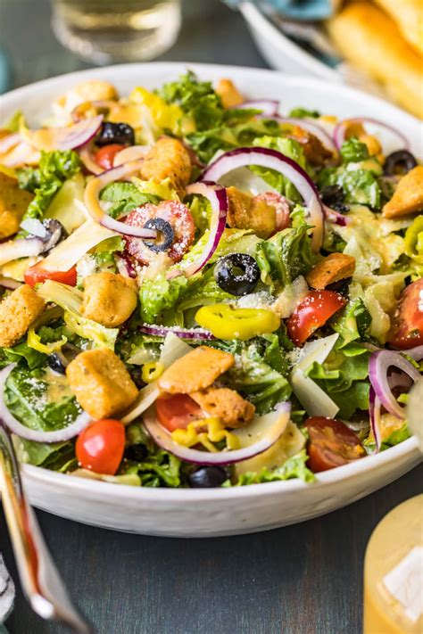 A copycat recipe for the famous olive garden salad, complete with juicy sweet tomatoes, tangy pepperoncini peppers, savory black olives, zesty parmesan cheese, sharp red onions, and garlicky croutons. Olive Garden Salad with Copycat Dressing - The Cookie ...