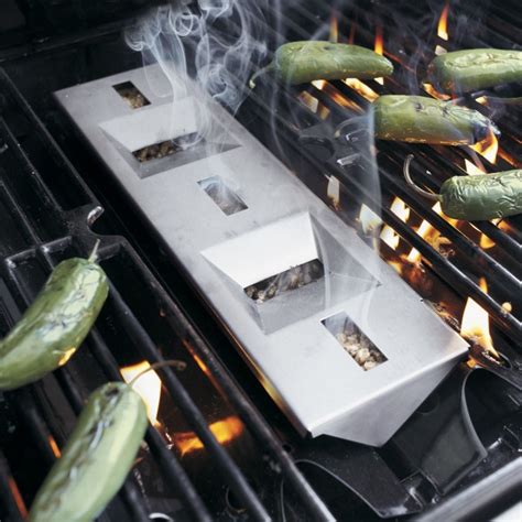 You ignite one end of the tube with a butane torch. Gas-Grill-Smoker-Box