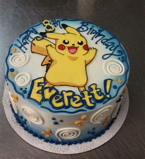 A Whimsical Pokemon Cake With Hand Illustraded Pikachu In Buttercream