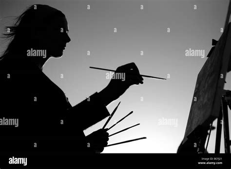 Artist At Work Holding Pencils Stock Photo Alamy