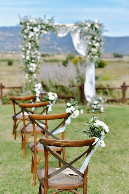 Free Photo Brown Chiavari Chairs Decorated With White Eustomas
