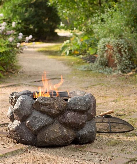 The poker matches the metal base in a. Four-Piece Faux Rock Fire Pit Set | Fire pit sets, Fire ...