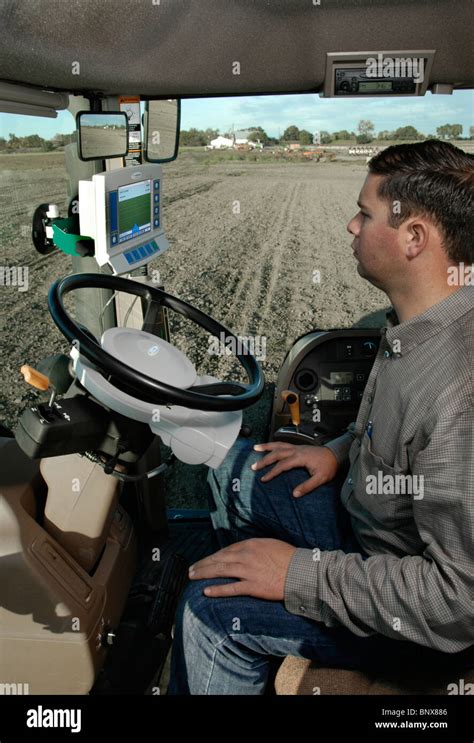 A Tractor Driver With Gps Navigation For Accurate Field Grading Stock