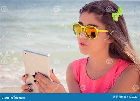 Portrait Of A Pretty Teenage Girl In Sunglasses On A Beach Stock Image