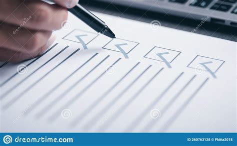 Human Hand Check Mark On Papercheck Concept Through Checkboxes