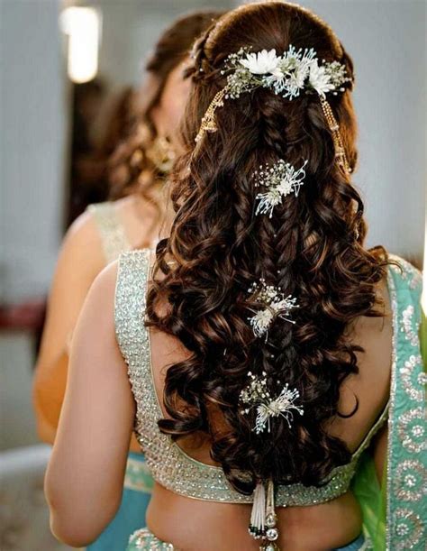Half Tied Hairdo With Soft Curls Some Braids And Flowers